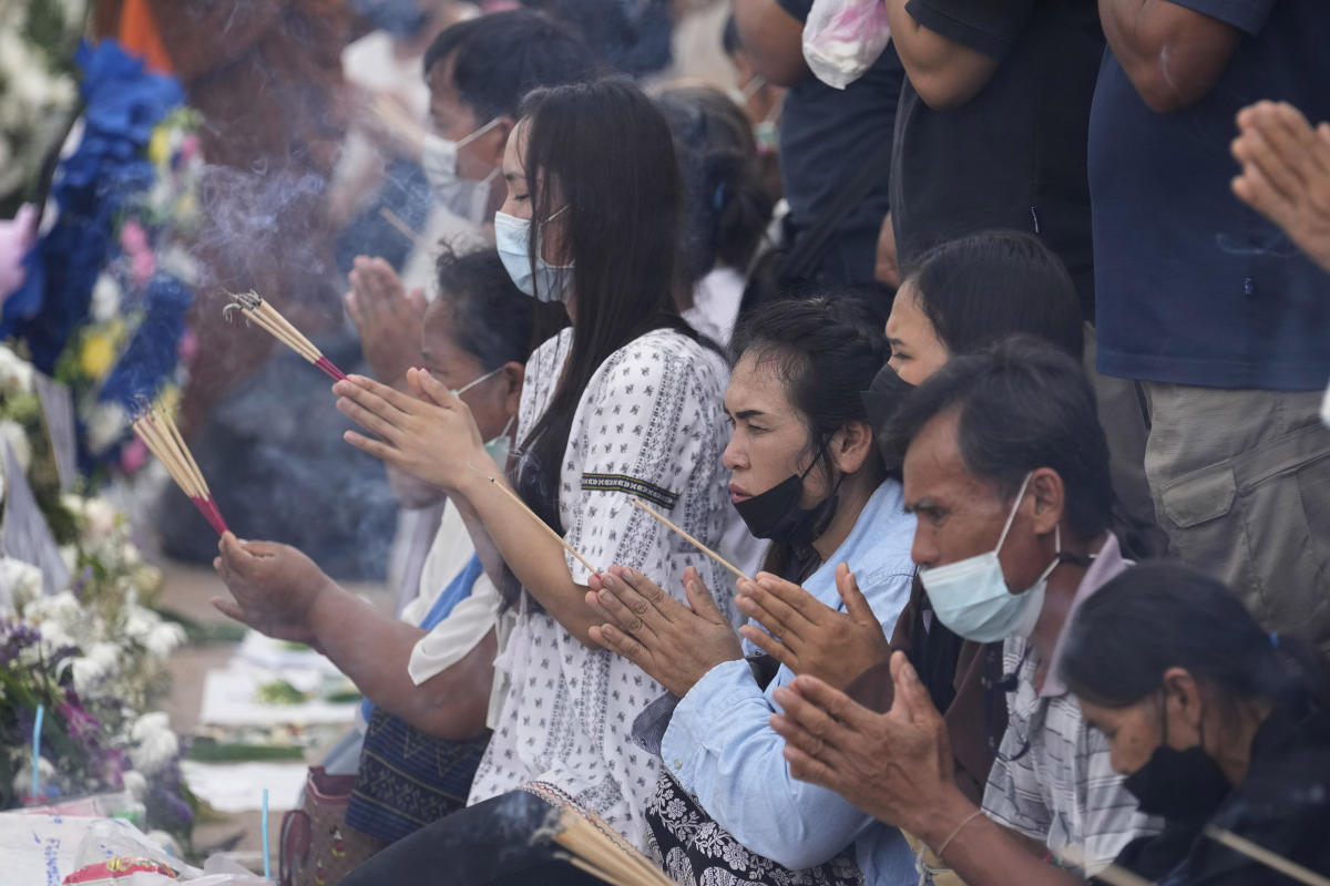 Families leave offerings for children slain at Thai day care