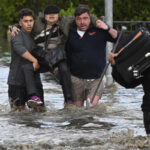 Homes inundated by swollen rivers in Australian floods