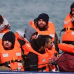 How many migrants cross the English Channel in small boats?