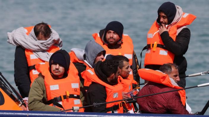 How many migrants cross the English Channel in small boats?