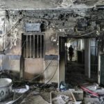 Iran prison fire toll doubles as protest tensions surge