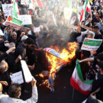 Mahsa Amini did not die from blows to body, Iranian coroner says amid widespread protests