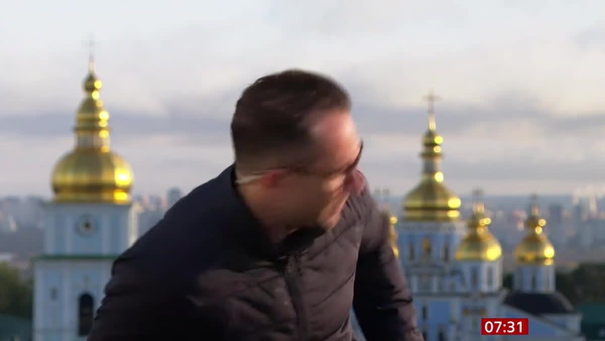 Moment BBC journalist takes cover as Russian missiles hit Kyiv during live broadcast