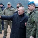 Putin visits military draft training centre