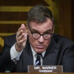 Senate’s Warner Scolds Apple, Tesla for ‘Blind Eye’ Toward China