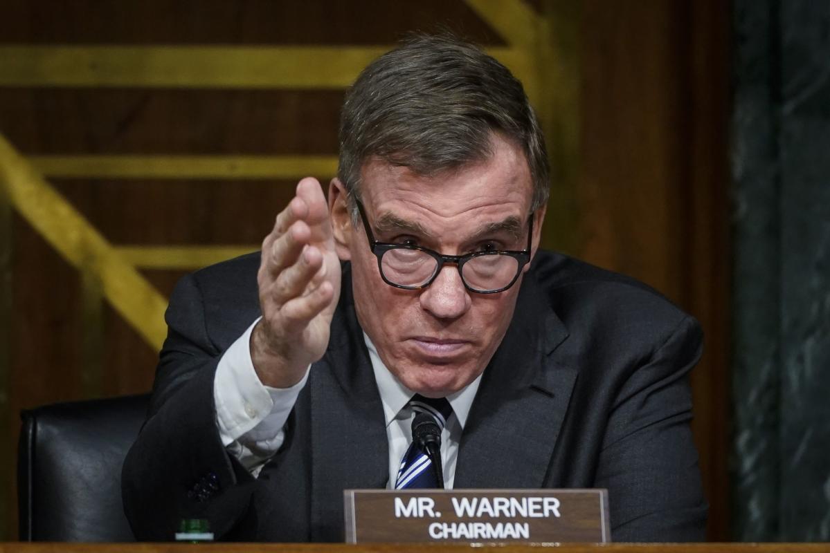 Senate’s Warner Scolds Apple, Tesla for ‘Blind Eye’ Toward China