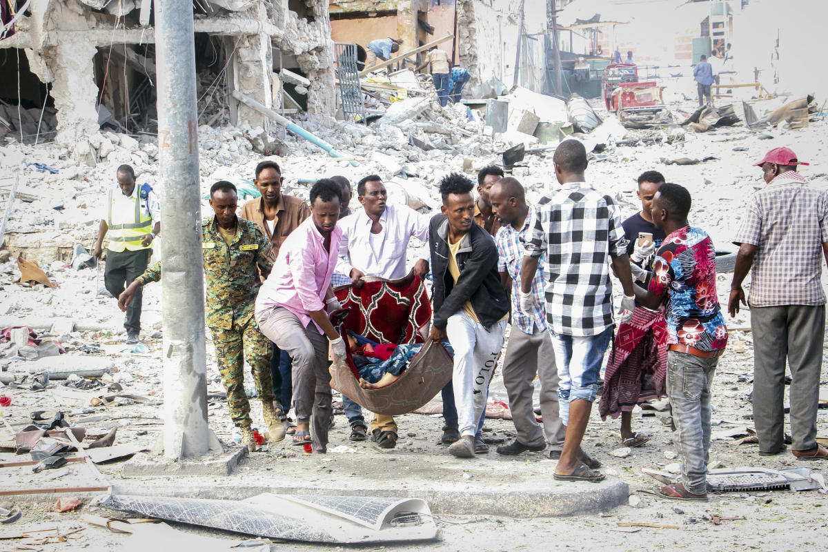 Two explosions rock Somalia’s capital, leaving “scores” dead