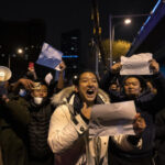 China’s Xi Jinping faces calls to resign amid unprecedented protests