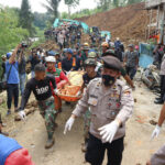 Indonesian rescuers search through rubble of quake; 268 dead