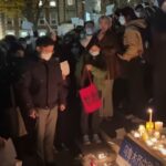 Hundreds across US hold up blank sheets of paper while protesting in solidarity with Chinese citizens