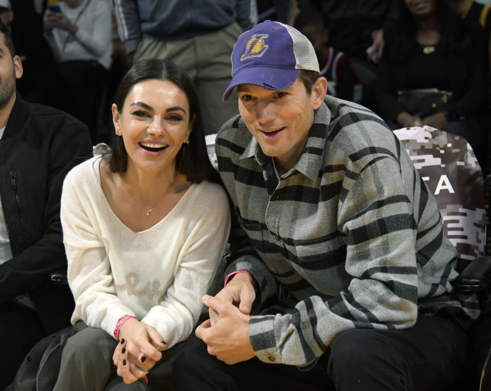 Mila Kunis was ‘curled up’ by Ashton Kutcher’s side during life-threatening illness: ‘She’s the best’