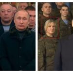 Putin records New Years greeting with uniformed people in background