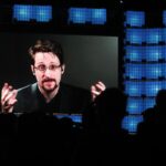 Snowden receives Russian passport, takes citizenship oath