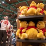 The Disney Store in Japan is selling a shirt that shows Winnie the Pooh holding up a white sheet of paper — the same protest symbol sweeping across China